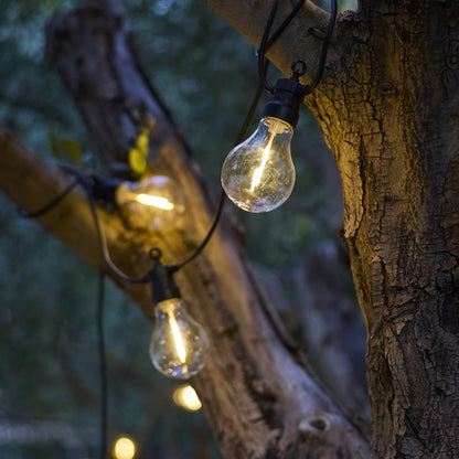 Guirlande lumineuses extérieur raccordable 20 globes transparents LED blanc chaud dimmable PARTY CLEAR HYBRID 8m solaire et sur secteur 13m